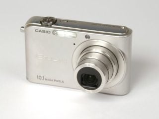 Silver Casio Exilim EX-Z1000 compact digital camera with lens extended, 10.1 megapixels, photographed on a white background.