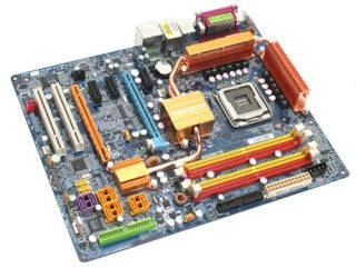 Gigabyte GA-965P-DQ6 Core 2 Duo motherboard with multiple colored ports and expansion slots, and large copper heat sinks.