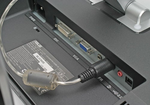 Close-up view of the back panel of an Asus PG191 Gaming Monitor showing the ports with a power cable connected.