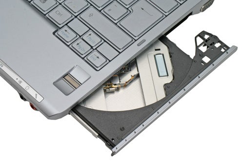 Sony VAIO VGN-TX3XP ultra-portable notebook with its drive bay open, revealing the internal hard drive and components.