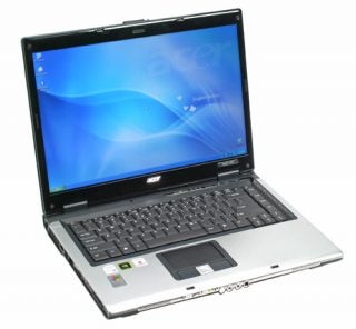 Acer Aspire 5650 3G laptop open on a table showcasing its screen, keyboard, and touchpad with metallic and black color design.