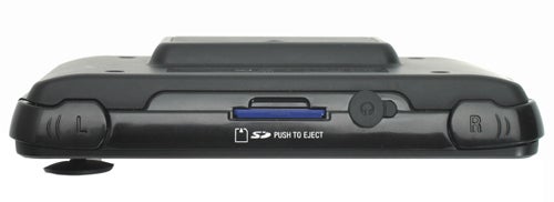 Side view of a black GP2X Personal Entertainment Player showing the SD card slot, control buttons, and shoulder buttons.