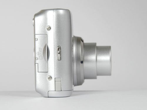 Silver Nikon Coolpix L4 digital camera with its lens extended, displayed against a white background.