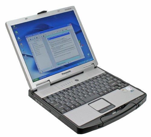 Panasonic ToughBook CF-74 rugged notebook open on a desk showing screen, keyboard, and trackpad.