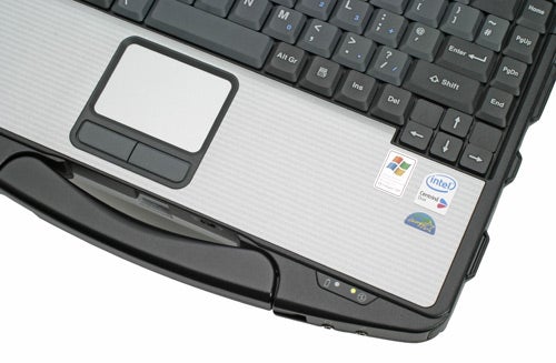 Close-up of a Panasonic ToughBook CF-74 rugged laptop keyboard and touchpad area, showing the Windows and Intel stickers on the palm rest.
