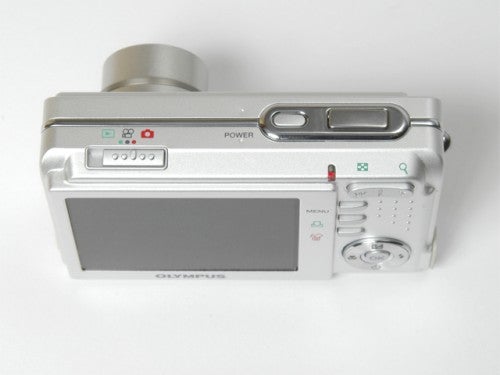 Olympus FE-150 digital camera with silver body, displaying the rear LCD screen and control buttons.