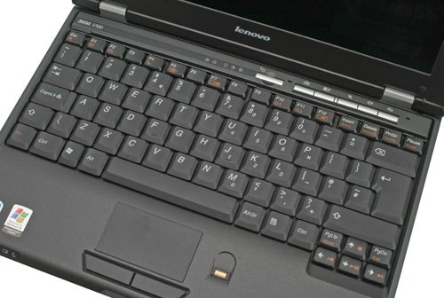 Lenovo 3000 V100 Ultra Portable Notebook with an open lid, showing the keyboard and trackpad, with the Lenovo logo visible on the lower screen bezel.