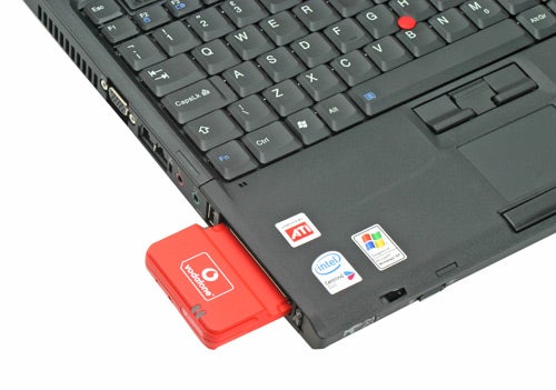Vodafone Mobile Connect HSDPA Data Card inserted into a laptop's USB port.