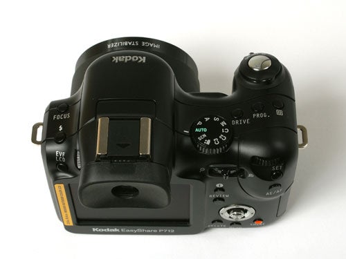 Kodak EasyShare P712 digital camera on a white background showing the top layout with focus button, mode dial, and other controls.