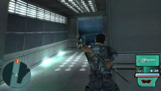 Screenshot from the video game Syphon Filter: Dark Mirror showing a player character aiming a sniper rifle at an enemy in a corridor with user interface elements displaying the ammunition count and health status.