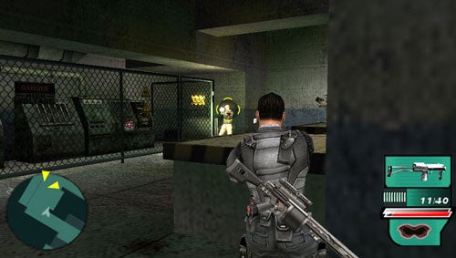 In-game screenshot of Syphon Filter: Dark Mirror showing a character aiming a pistol at an enemy in a dimly lit industrial environment with HUD elements displaying the direction, weapon, and ammunition count.