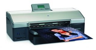 HP Photosmart 8750 Professional printer with a color photo printout emerging from the device, showcasing its printing capabilities.