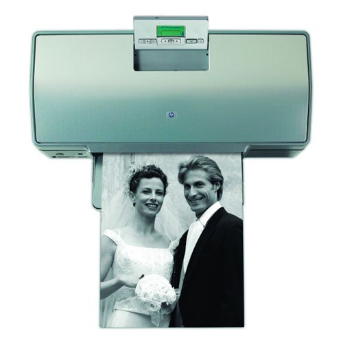 HP Photosmart 8750 Professional printer with an output photo featuring a smiling bride and groom in wedding attire.