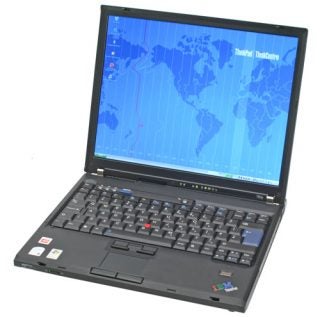 Lenovo IBM ThinkPad T60p laptop open at a 90-degree angle showing its keyboard, trackpoint, touchpad, and display with a world map wallpaper.