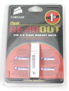Corsair Flash Readout USB 2.0 memory drive with a 1 GB capacity, packaged in a clear plastic blister pack on a red background, featuring a 10-year warranty label.
