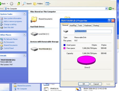Screenshot of a computer screen showing a Corsair Flash Readout USB Memory Key properties dialog box on a Windows XP interface, with 1 GB capacity highlighted, indicating available storage space.