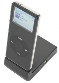 Black Marware iPod nano docking stand with an iPod nano displaying the 'Now Playing' screen showing the song 