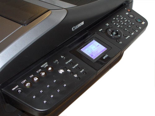 Close-up view of the Canon PIXMA MP830 multi-function printer's control panel with LCD display and buttons.