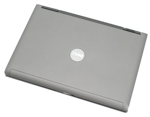 Dell Latitude D420 laptop closed lid view on a white background, showcasing the silver cover with the Dell logo.