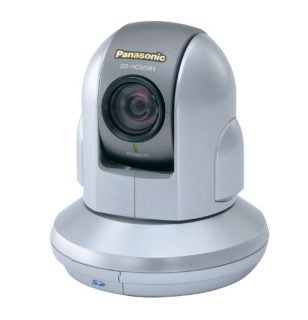 Panasonic BB-HCM381 IP camera with a silver and gray design, featuring a prominent lens, power indicator, and SD card slot.