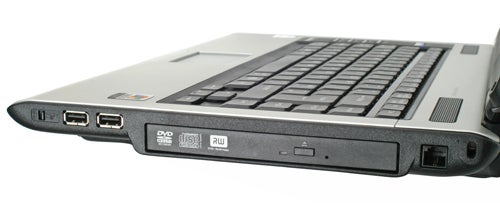 Close-up view of a Toshiba Satellite Pro A100 laptop's side panel showing USB ports, a DVD drive, and various other interface ports.