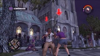Screenshot from the video game Saints Row showing an in-game scene where a character is holding a camera, with other characters in various poses in front of a Gothic-style building in the evening.