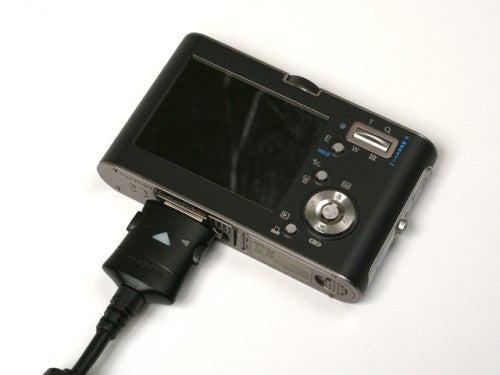 Samsung NV3 camera connected to USB cable.