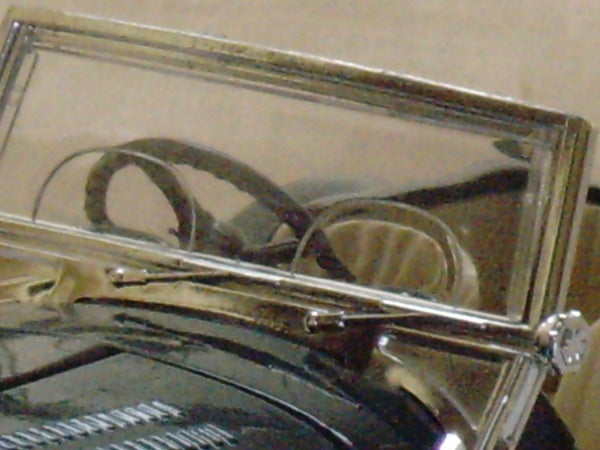 image of eyeglasses reflecting in a mirror.