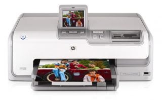 HP Photosmart D7360 inkjet printer with a displayed photo printout and an LCD screen showing image preview.