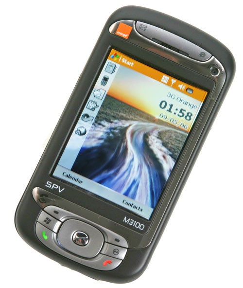 Orange SPV M3100 3G smartphone with a touchscreen display showing the start screen with date, time, and quick access icons for calendar and contacts, encased in a black protective casing with the SPV and M3100 model branding visible.