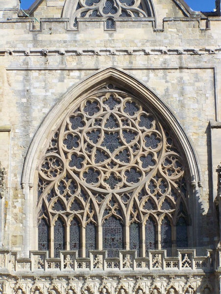 A detailed photograph of an ornate gothic rose window on a cathedral, showcasing the intricate stonework and the clear image quality taken with a Kodak EasyShare Z650 camera.