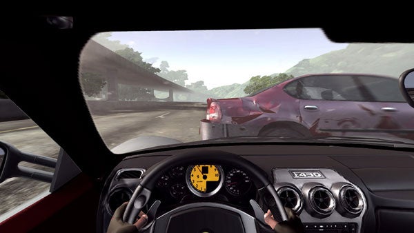 First-person view from the driver's seat in the video game Test Drive Unlimited, showcasing the interior of a Ferrari F430 with hands on the steering wheel, dashboard gauges visible, and driving on a road beside another car.