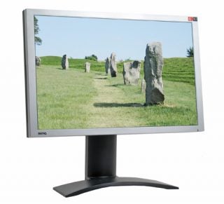 A BenQ FP241W 24-inch widescreen monitor displaying an image of standing stones in a grassy field, with the BenQ logo visible on the lower bezel.