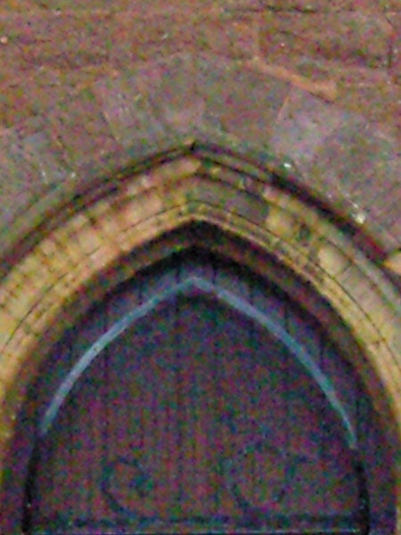 Blurred photo of a gothic arch window.