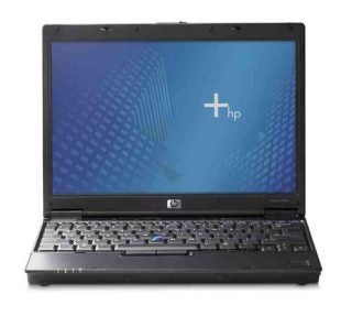HP Compaq nc2400 Ultra-Portable Notebook opened on a plain background displaying the HP logo on the screen.