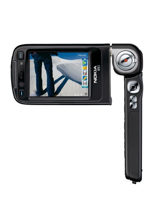 Nokia N93 mobile phone with swivel screen open, showing camera interface and a photo of a person's shadow on the screen.