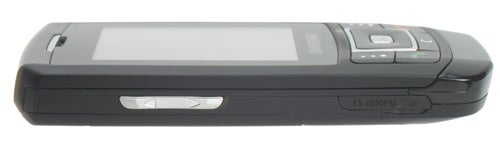 Side view of a Samsung SGH-D900 Ultra-Slim mobile phone showcasing its slim profile and external buttons.