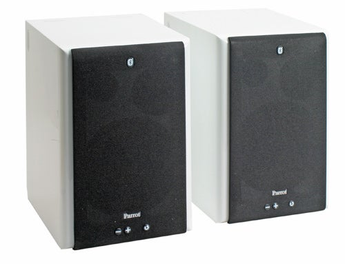 Pair of Parrot Bluetooth speakers in white casings with black front panels, featuring the Parrot logo and control buttons.
