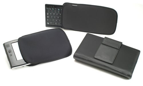 Samsung Q1 Ultra Mobile PC with detachable keyboard and protective cases displayed on a white background.