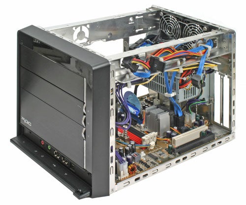 Shuttle XPC SN27P2 small form factor barebone system open view showcasing internal components including motherboard, power supply, cooling fan, and cable management.