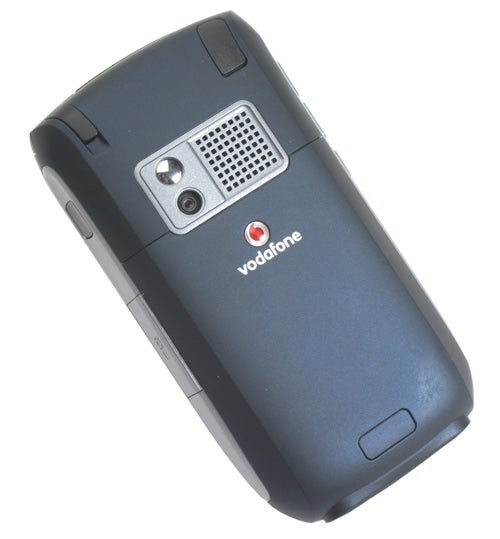 Palm Treo 750v smartphone with Vodafone branding viewed from the back, showing a camera, speaker, and antenna area on a grey textured surface.