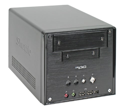 Shuttle XPC SK22G2 Small Form Factor Barebone system with front panel USB, audio ports, and drive bays visible.
