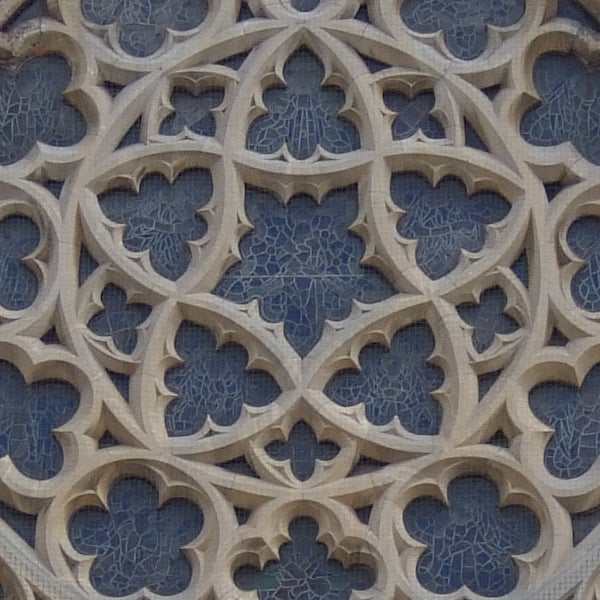 The image shows a close-up of an intricate stone lattice pattern, featuring gothic architectural elements. While this does not directly relate to the Fujifilm Finepix F30, it could illustrate the camera's capability to capture detailed patterns and textures given its high-quality sensor and lens.