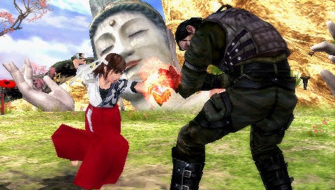 Screenshot from the video game Tekken: Dark Resurrection showing two characters fighting, with a large Buddha statue in the background.