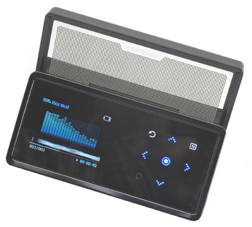 Samsung YP-K5 MP3 player with the slide-out speaker extended, displaying a blue graphical equalizer on its screen and playback controls illuminated in blue.