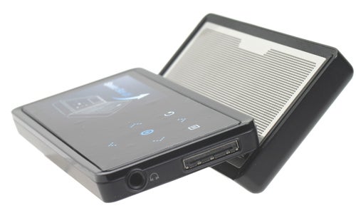 Samsung YP-K5 MP3 player with built-in speakers open, displaying the touchscreen interface and volume controls.