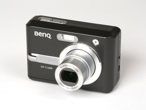 A BenQ DC C1000 10-megapixel compact digital camera positioned on a white background, featuring a telescopic lens, flash, and viewfinder.