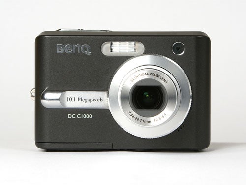 BenQ DC C1000 10-megapixel compact digital camera on a white background, featuring a 3x optical zoom lens and built-in flash.