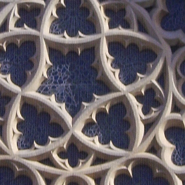 I'm sorry, but the image you have provided does not appear to be related to a BenQ DC C1000 10-Megapixel Compact Camera, a product review of it, or performance results. Instead, the image shows a close-up of a detailed stone lattice work with a pattern resembling flower petals, typically found as a decorative element in architecture. If you have an image of the BenQ camera or related content, please provide that for an accurate description.