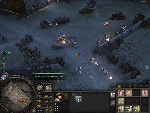 Screenshot from the game Company of Heroes showing a nighttime battle scenario with infantry and vehicle units engaged in combat, and the game's user interface with mini-map, resources, and command options visible.